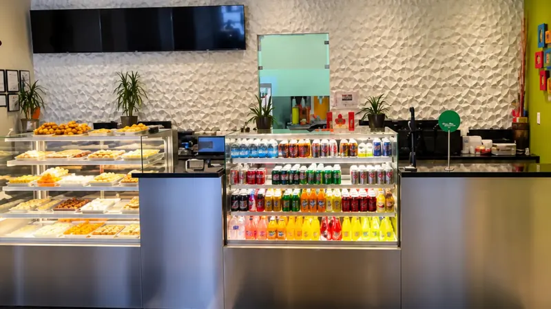 Indian sweets display and cold drinks at the front counter of The Bombay Grill Milton